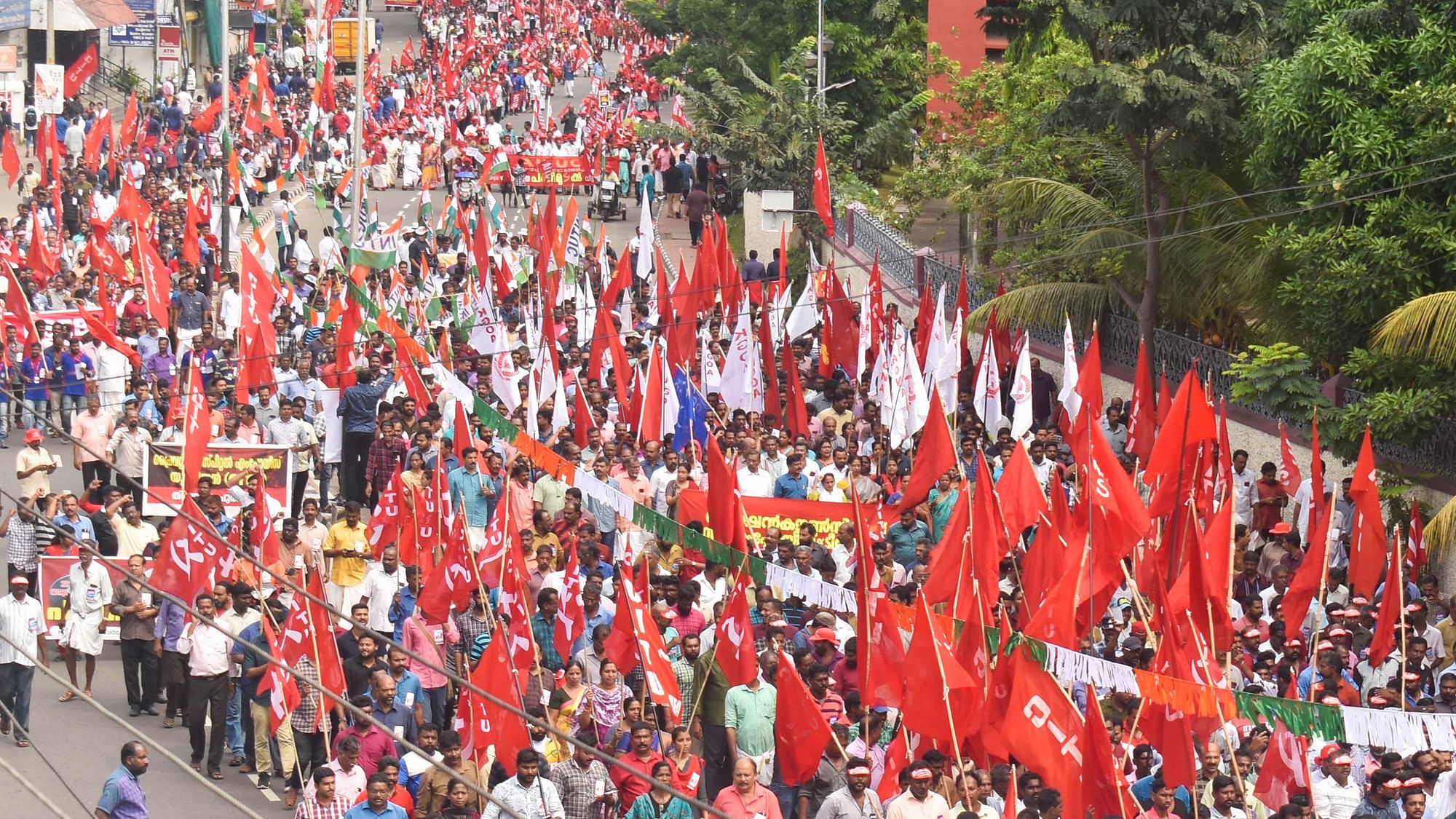 Trade union workers take out a march during their nationwide 24-hour general strike, in Thiruvananthapuram.