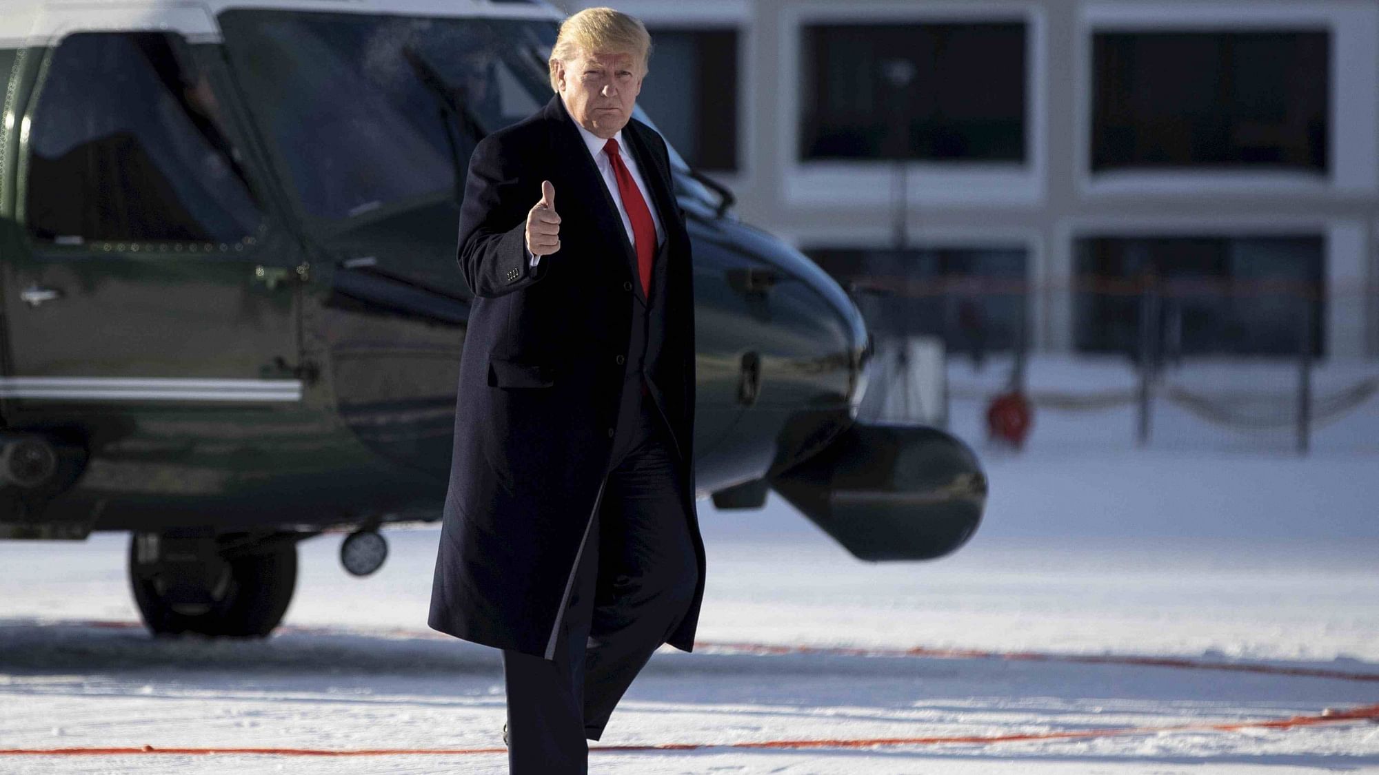 US President Donald Trump gestures as he arrives in Davos, Switzerland on 21 January.