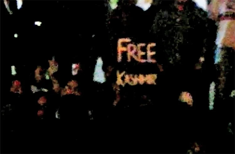 Taking notice of this, the police have filed sedition charges against the young woman who held the poster.