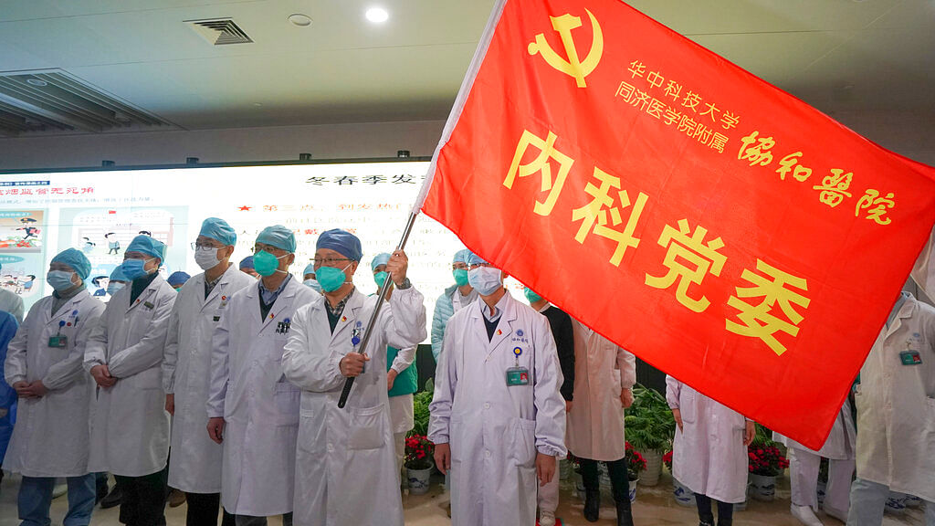 In this Jan. 22, 2020, photo released on Thursday, Jan. 23, 2020, by China’s Xinhua News Agency, medical workers of the Union Hospital with the Tongji Medical College of the Huazhong University of Science and Technology in Wuhan participate in a ceremony to form an “assault team” to battle against a coronavirus epidemic in Wuhan in central China’s Hubei Province, Jan. 23, 2020.&nbsp;