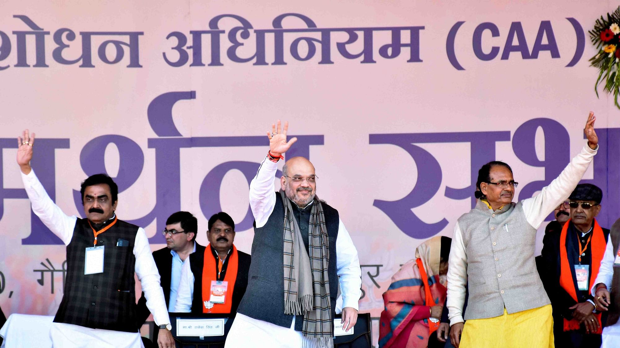 Union Home Minister Amit Shah with former MP chief minister Shivraj Singh Chouhan and State BJP president Rakesh Singh during a CAA awareness event, in Jabalpur.&nbsp;