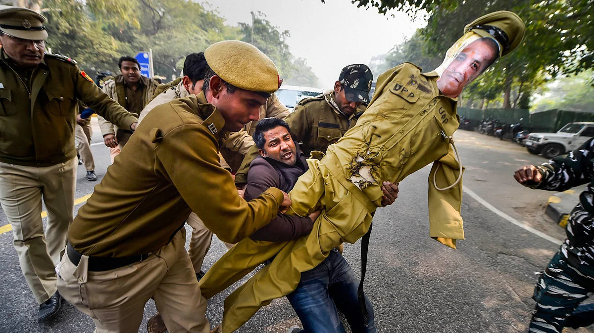 Police detains a protester protesting against the UP Police’s brutality during Citizenship Act Protests.