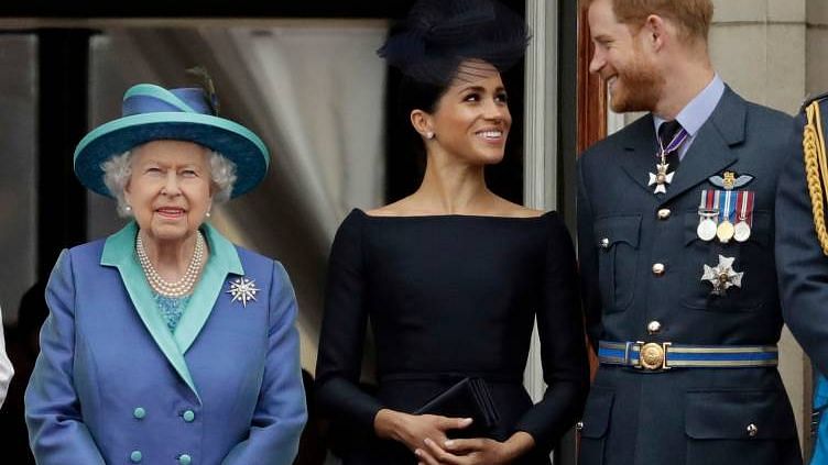 Britain’s Queen Elizabeth II with Meghan the Duchess of Sussex and Prince Harry.