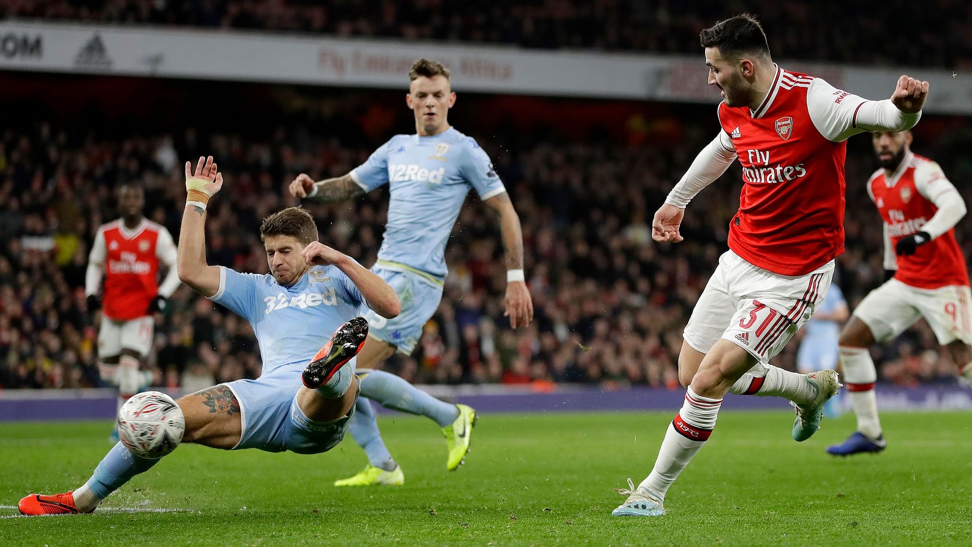 Arsenal’s Sead Kolasinac, right, shoots on goal during the English FA Cup soccer match between Arsenal and Leeds United at the Emirates Stadium in London, Monday, Jan. 6, 2020.