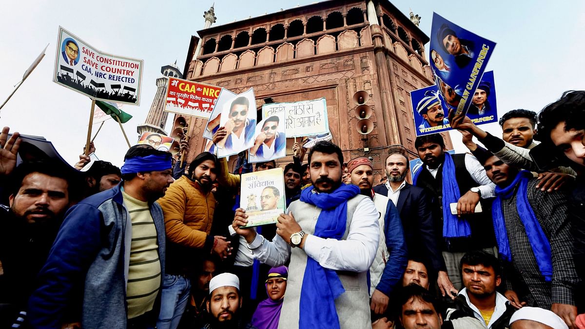 New Delhi: Bhim Army Chief Chandrasekhar Azad holds a copy of the Indian Constitution during a protest against Citizenship (Amendment) Act at Jama Masjid in New Delhi, Friday, 17 January, 2020.&nbsp;