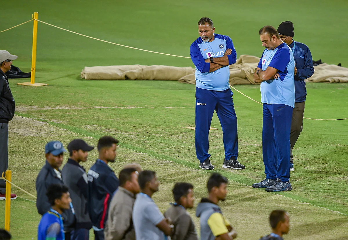 Head coach Ravi Shastri and batting coach Bharat Arun inspect the pitch during a practice session ahead of the 1st T20 cricket match against Sri Lanka, at Barsapara Cricket Stadium in Guwahati.