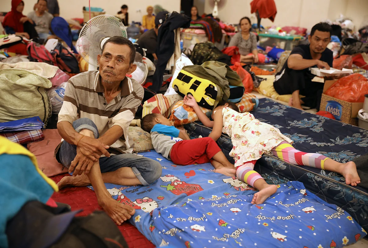 People rest at a temporary shelter for those affected by the floods in Jakarta, Indonesia.