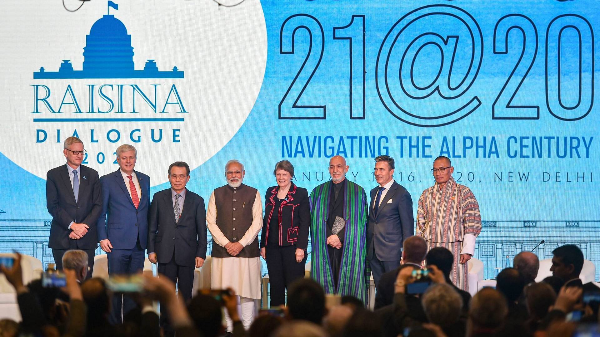 Prime Minister Narendra Modi in a group photo with the delegates during the inaugural session of Raisina Dialogue 2020, in New Delhi, on Tuesday, 14 January.