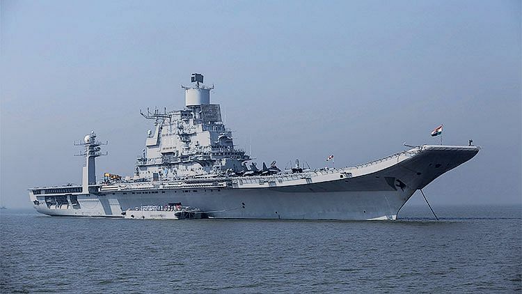 INS Vikramaditya, Indian Navy’s aircraft carrier, seen anchored in the Arabian sea as part of Navy Day celebrations off the coast of Mumbai.