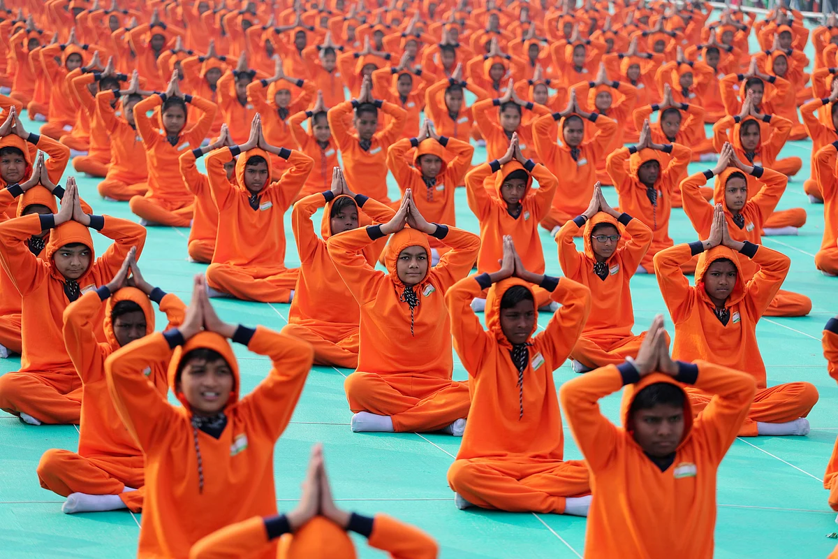 School children perform yoga during the inauguration of an International kite festival in Ahmadabad, on Tuesday, 7 January.