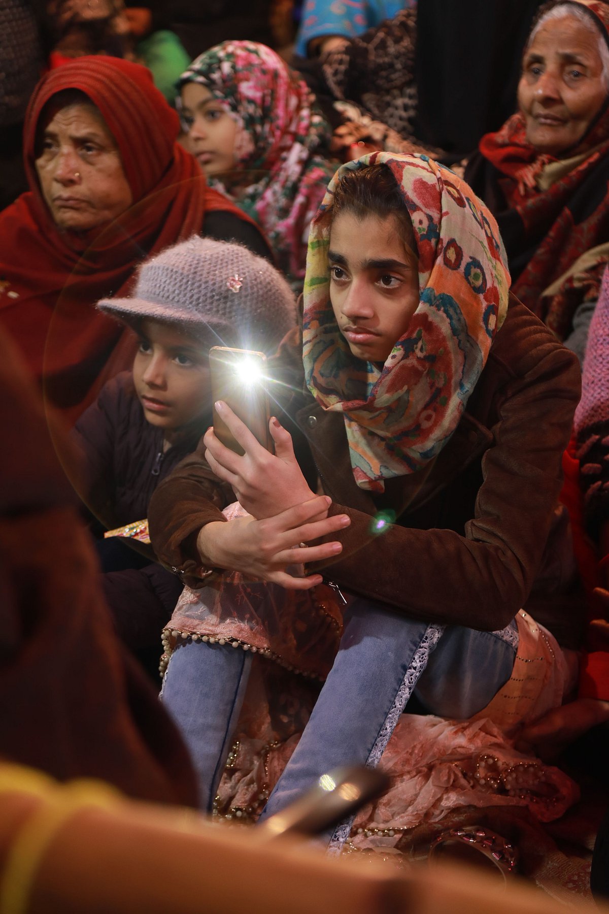 Women bring their children to the protests. The 24/7 protest began on 15 December.