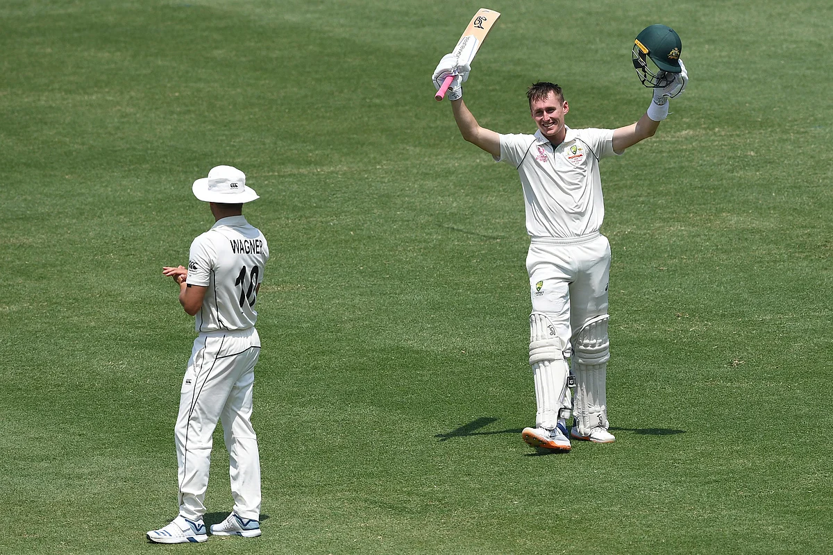 Australia’s Marnus Labuschagne celebrates his double century 200 not out as Neil Wagner looks on during play on day two of the third cricket test match between Australia and New Zealand.