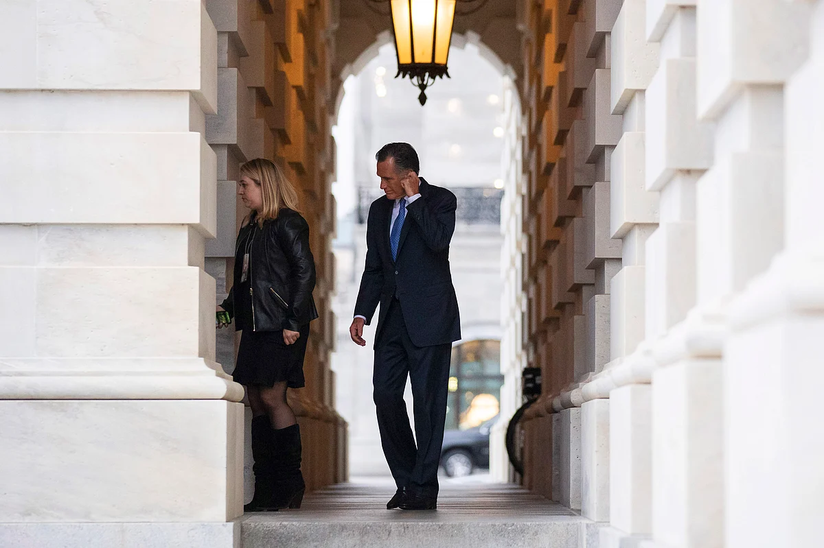 Mitt Romney, right, departs after the impeachment acquittal of President Donald Trump, on Capitol Hill, Wednesday, 5 Feb 2020.