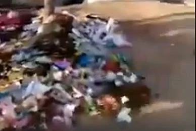 We found that the video shows heaps of garbage being thrown on the ground.