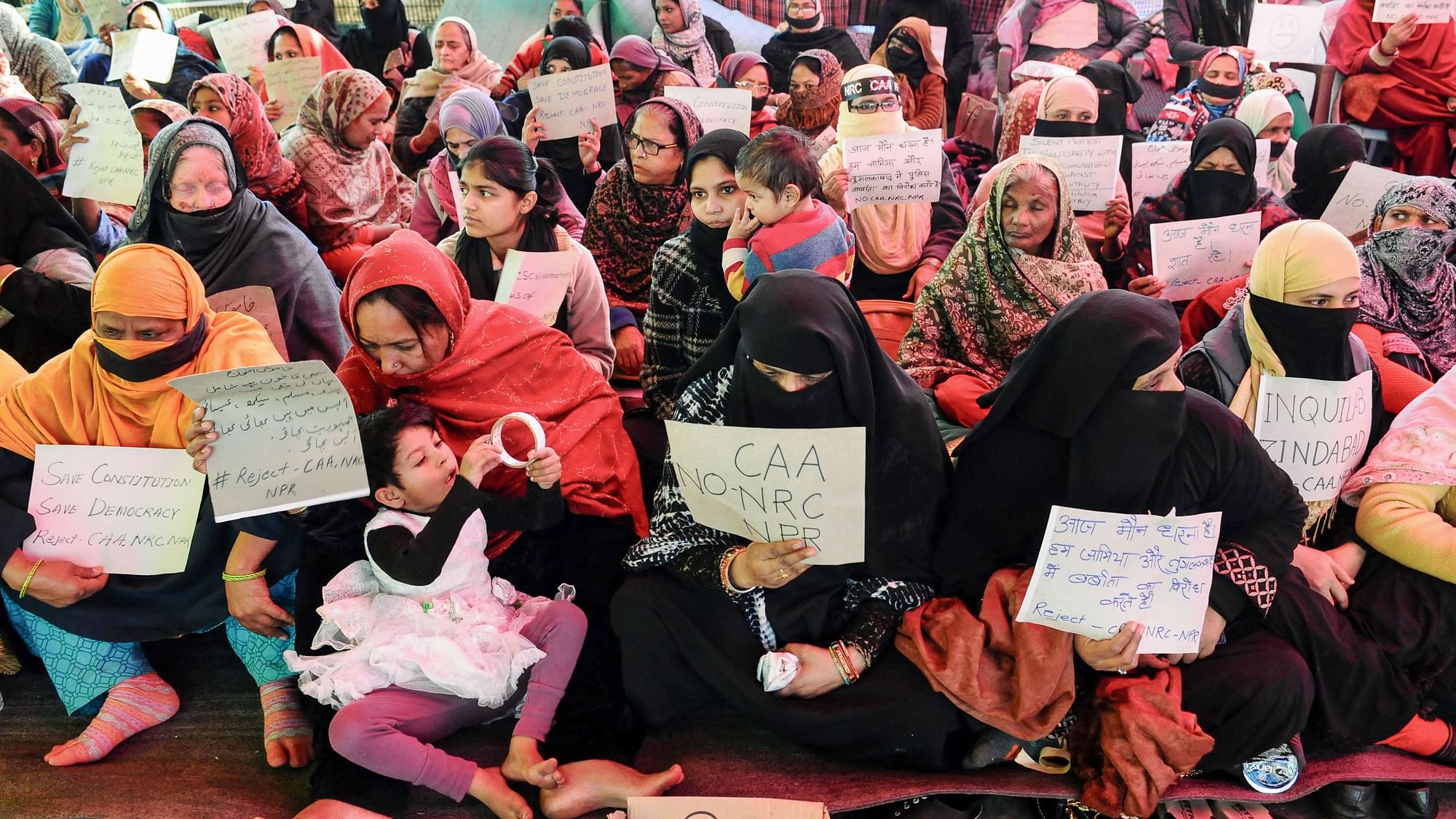 Anti-CAA Protests: Women and children hold placards during a silent protest against CAA and NRC at Shaheen Bagh in New Delhi. Image used for representation.