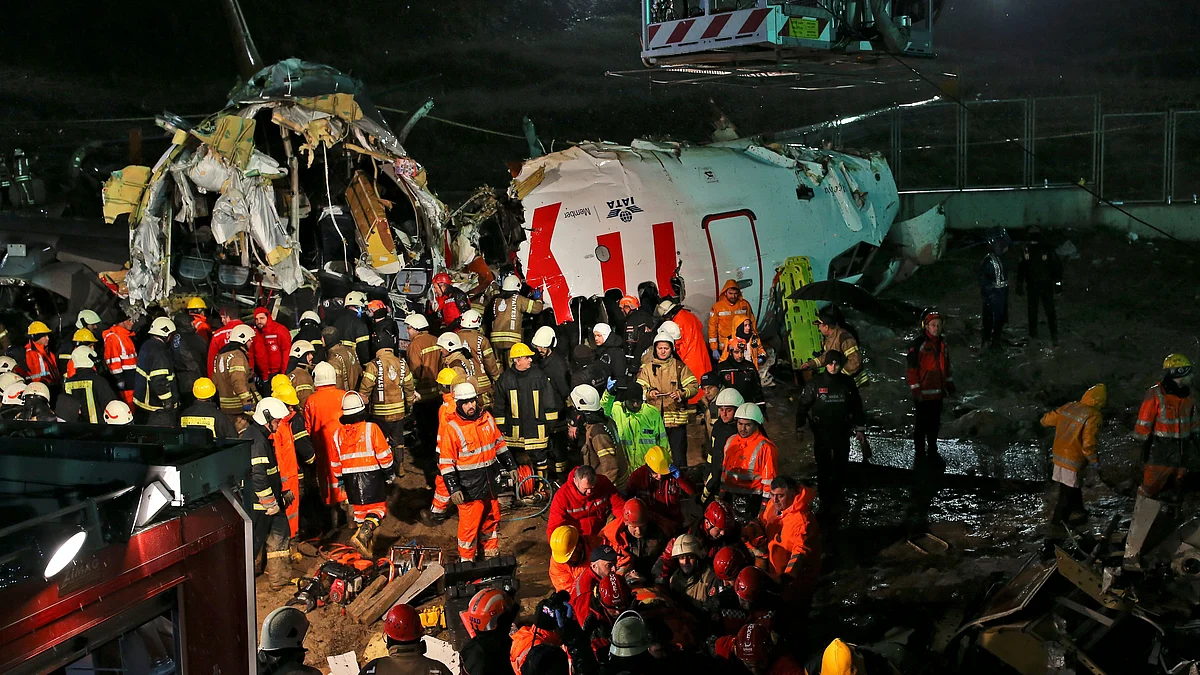 Rescue members evacuate an injured person from the wreckage of a plane after it skidded off the runway at Istanbul’s Sabiha Gokcen Airport. 