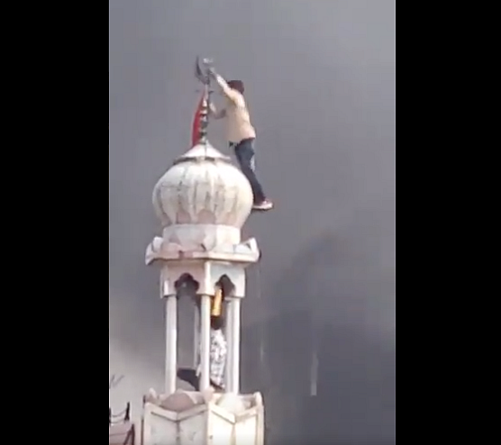 Viral Clip Shows Rioters Vandalising Mosque, Hoisting Saffron Flag