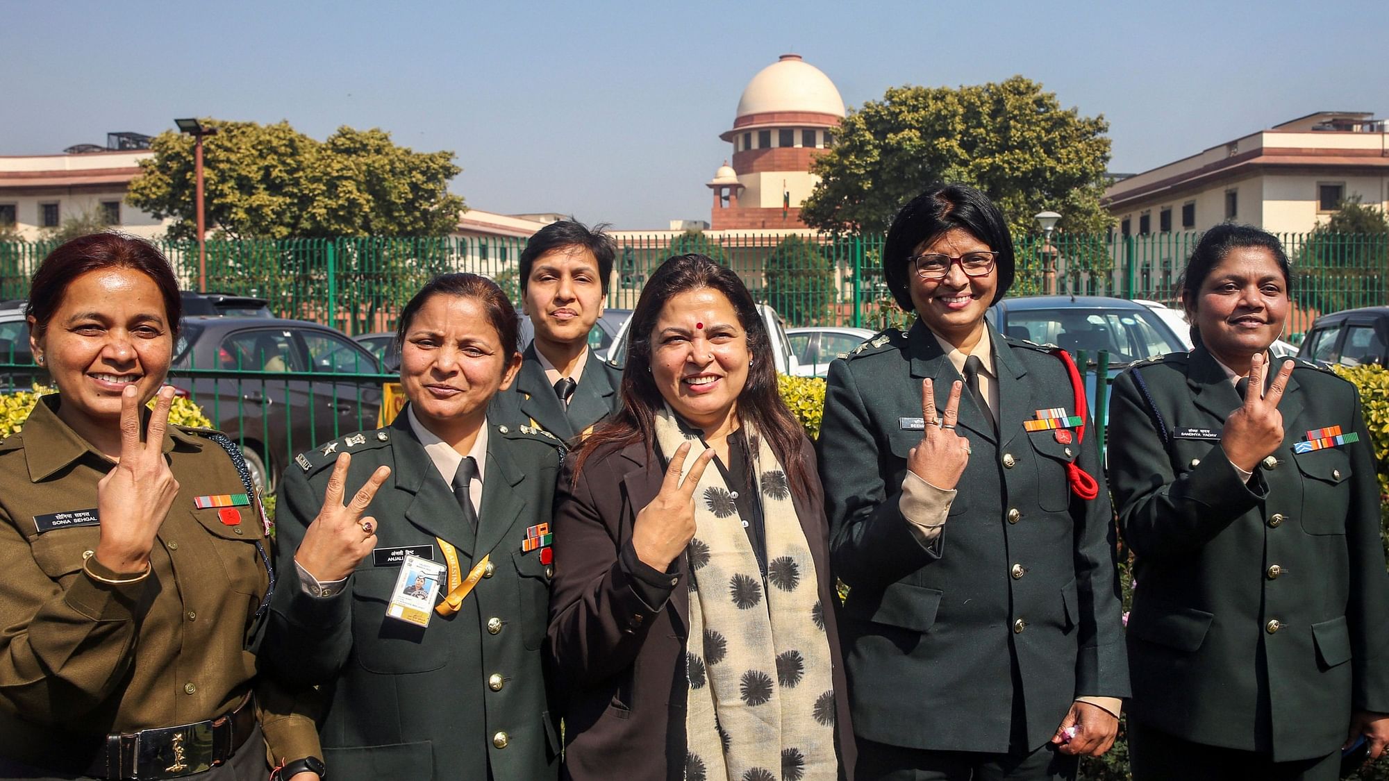 Women officers with advocate Meenakshi Lekhi outside the Supreme Court after the verdict.