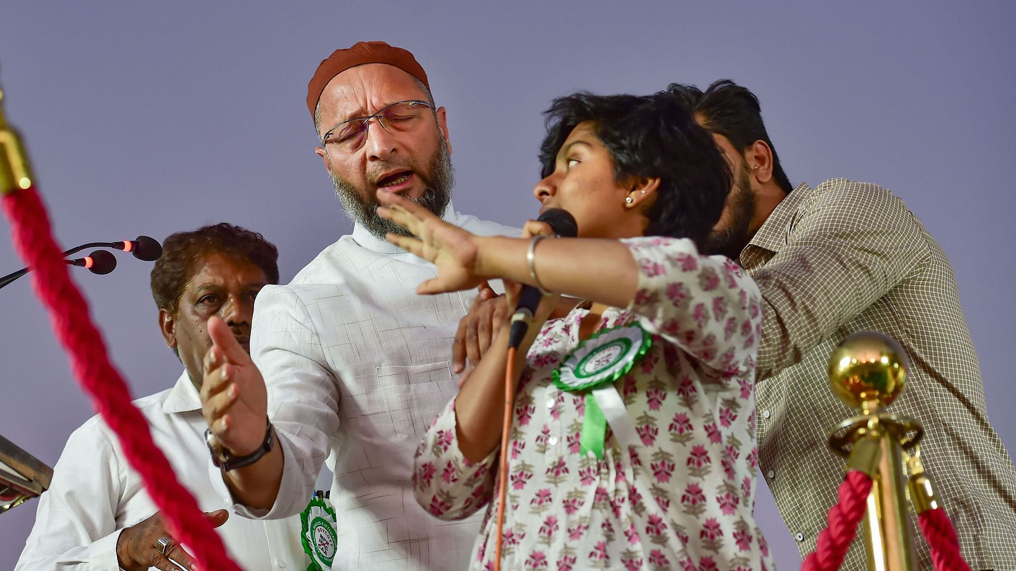 President of the AlI India MIM Asaduddin Owaisi attempts to stop a woman, identified as Amulya, who allegedly raised pro-Pakistan slogans during a protest against CAA, NRC and NPR in Bengaluru,on Thursday, 20 February.