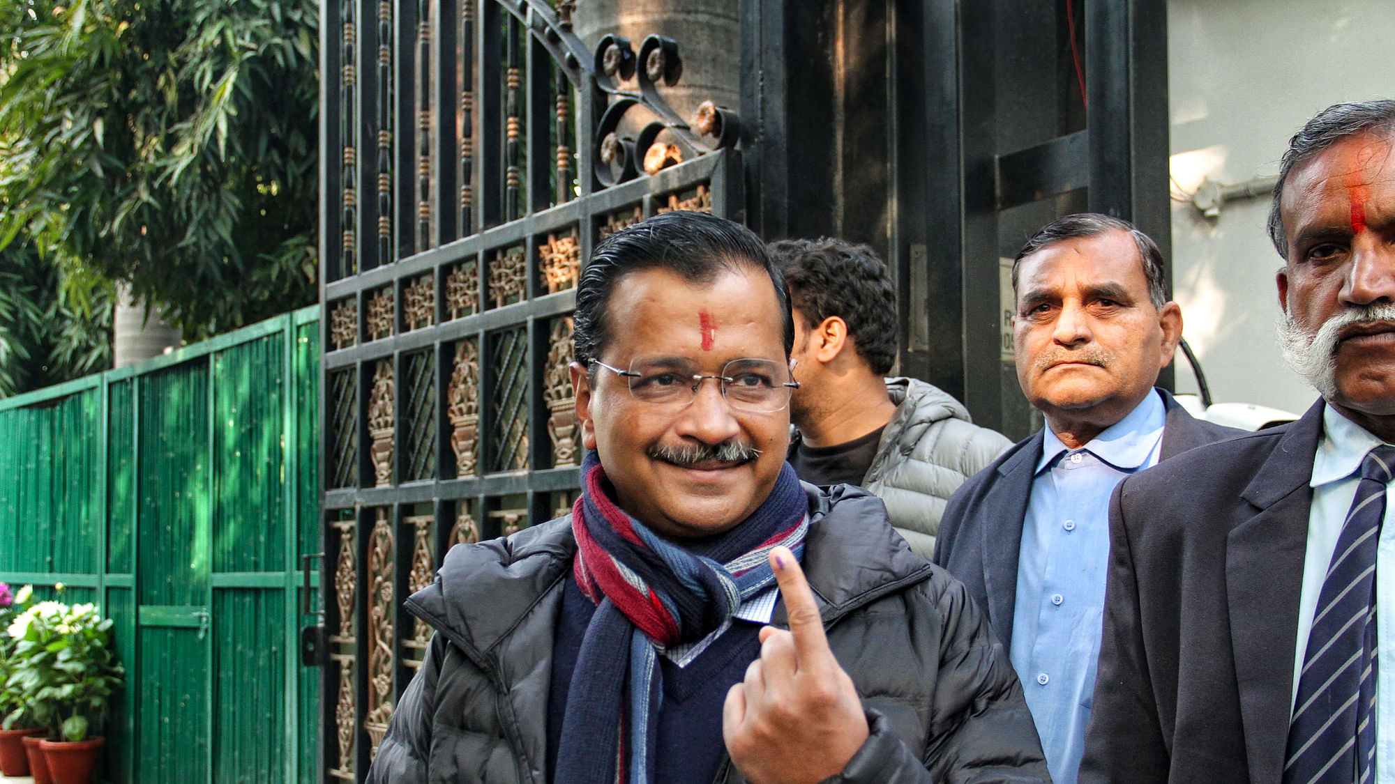 Delhi Chief Minister and AAP convenor Arvind Kejriwal shows his inked finger as he emerges from a polling station in the Civil Lines area after casting his vote for the Assembly elections, in New Delhi, Saturday.