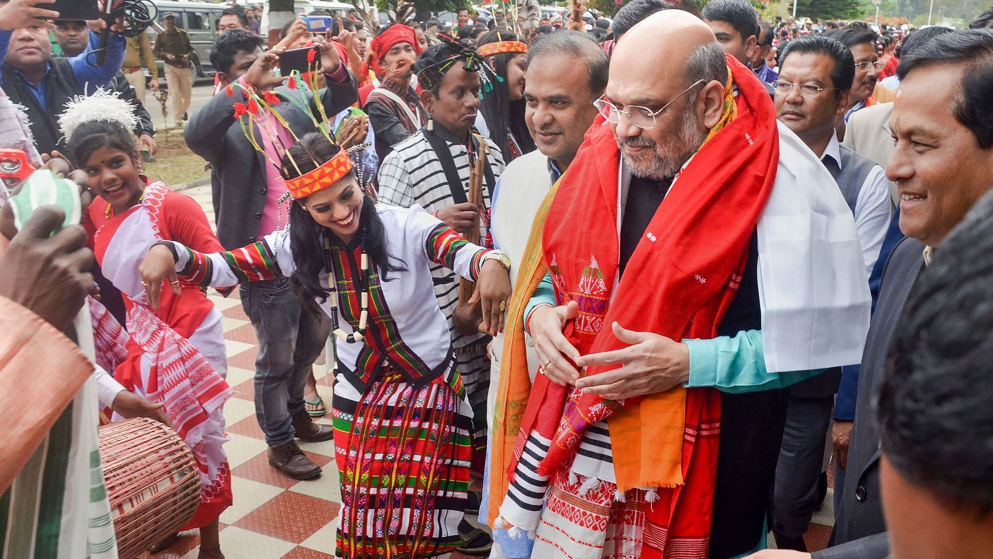 Artists performs as Union Home Minister Amit Shah arrives to attend the 34th Statehood Day of Arunachal Pradesh, in Lakhimpur Kheri district. 