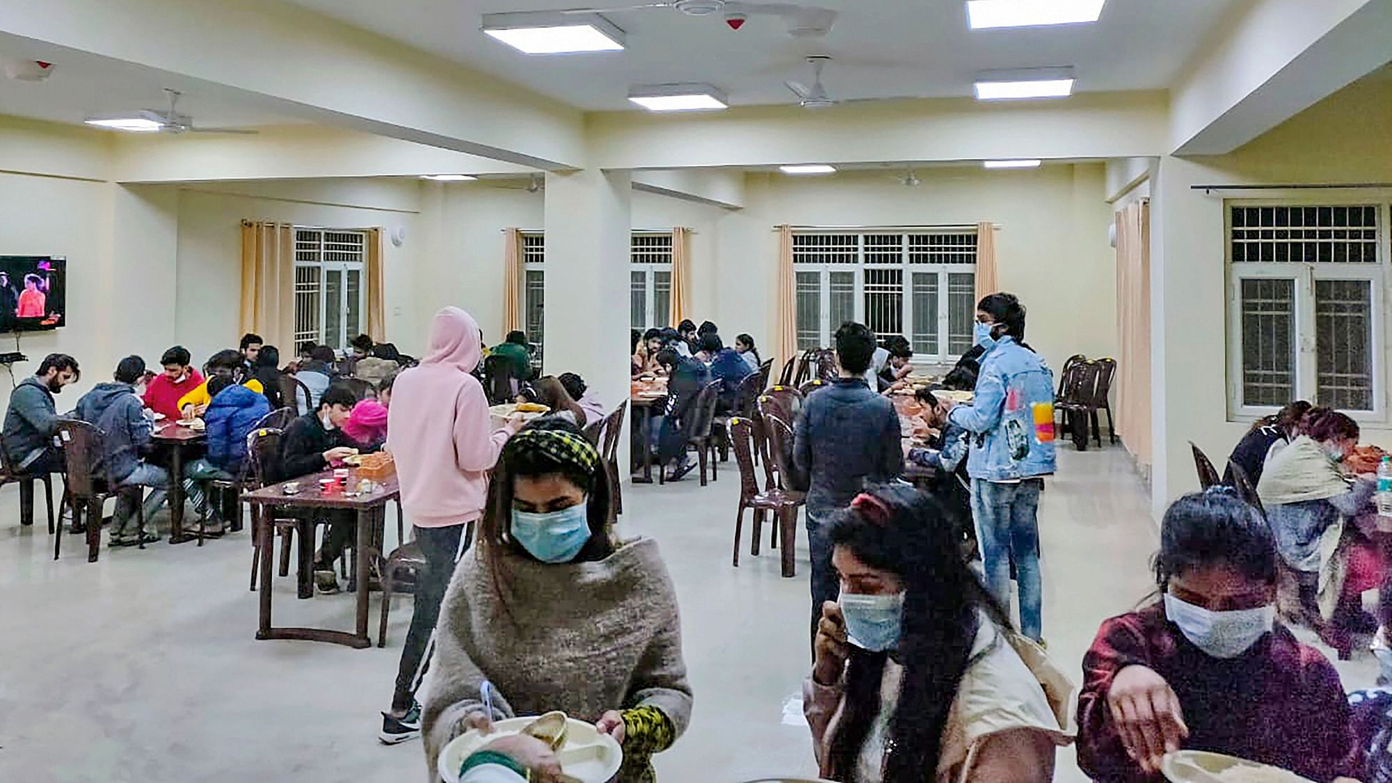 Indian nationals, who were airlifted from coronavirus-hit Wuhan city of Chinas Hubei province, have meal inside a quarantine facility set by up ITBP, in New Delhi