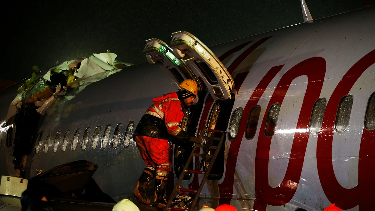The plane skidded off the runway, crashing into a field and breaking into pieces.