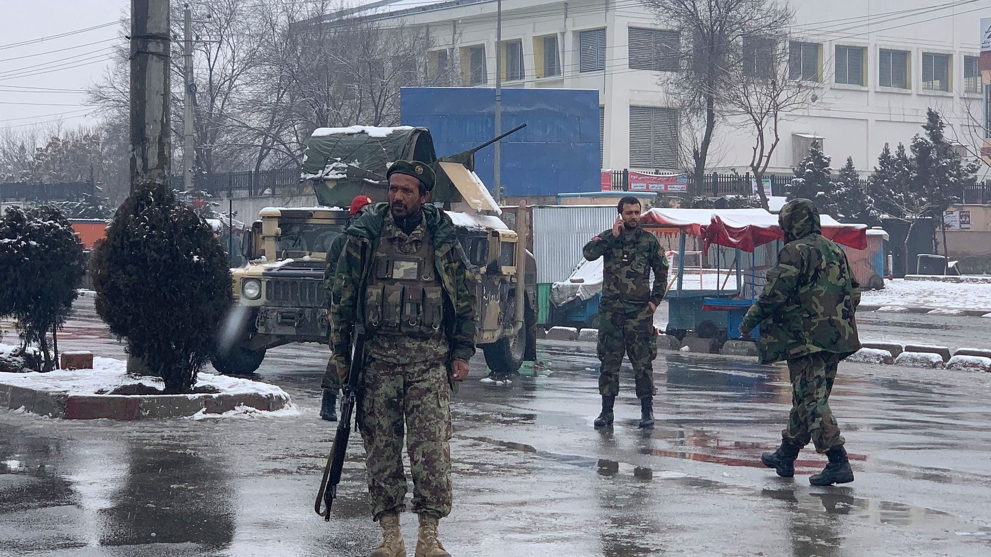 National army soldiers arrive at the site of explosion near the military academy in Kabul, Afghanistan on Tuesday, 11 February.