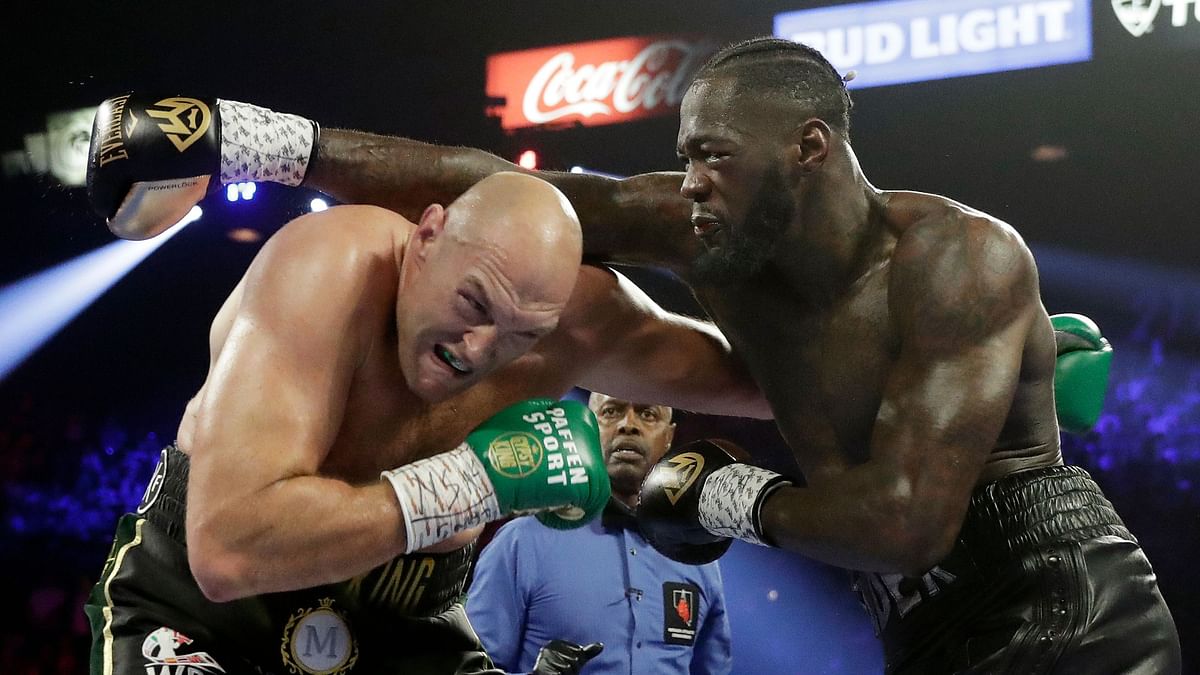 The two fighters are under contract for a third fight, though Wilder (right) could opt out of it as the loser.