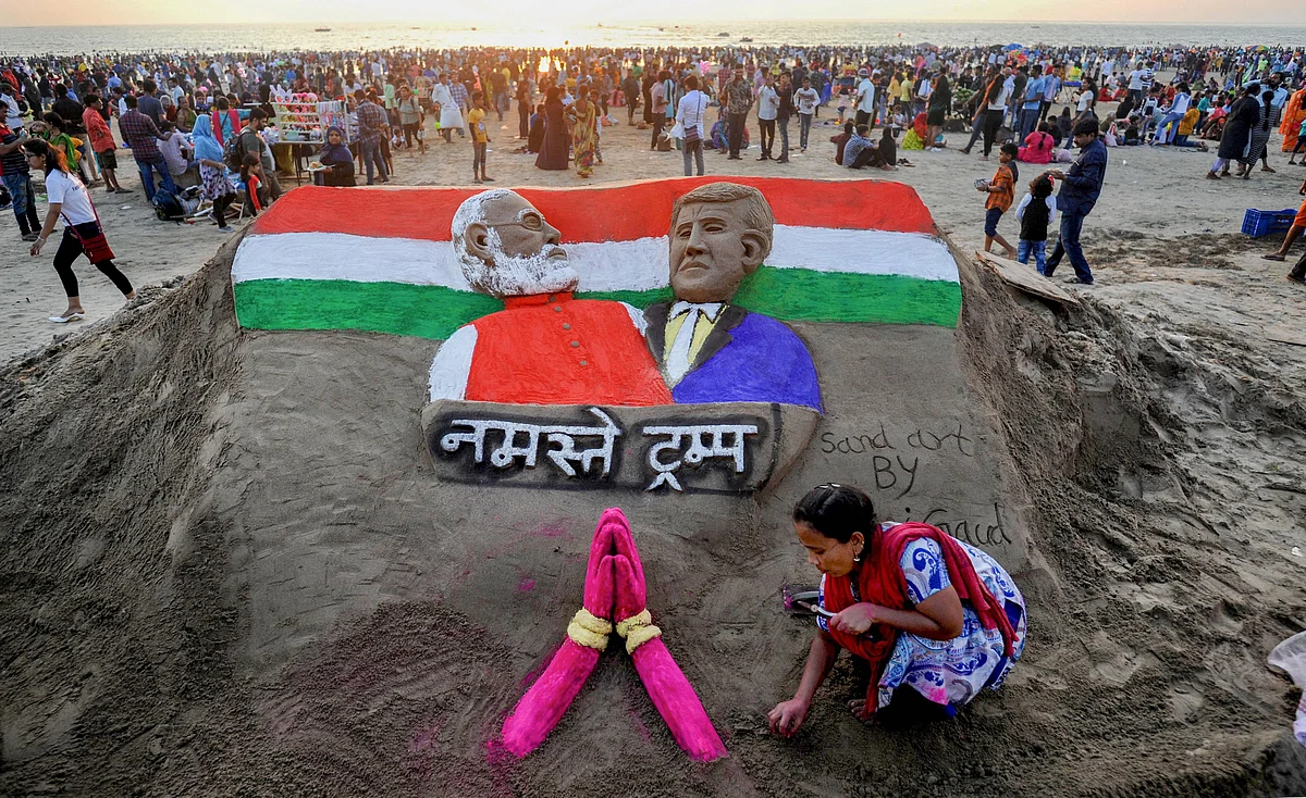 Sand artist Laxmi Gaud creates a sculpture of Prime Minister Narendra Modi and US President Donald Trump on the eve of latters maiden visit to India, at Juhu Beach in Mumbai, Sunday, 23 February.