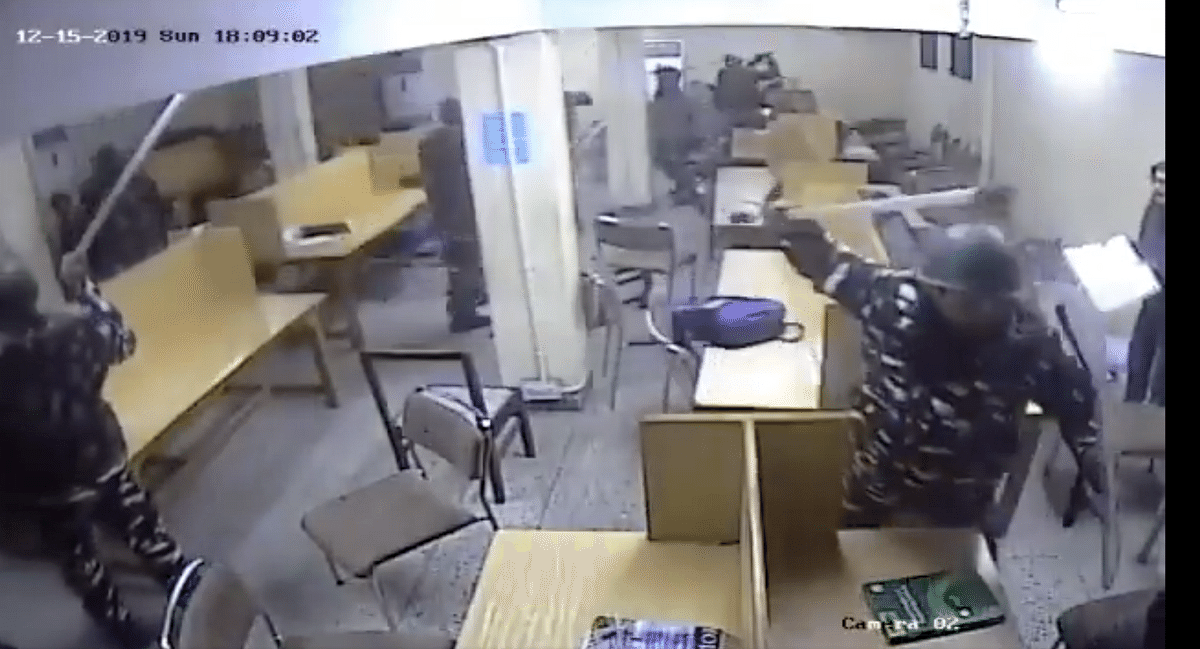 In the new footage, students can also be seen barricading the door shut with tables.