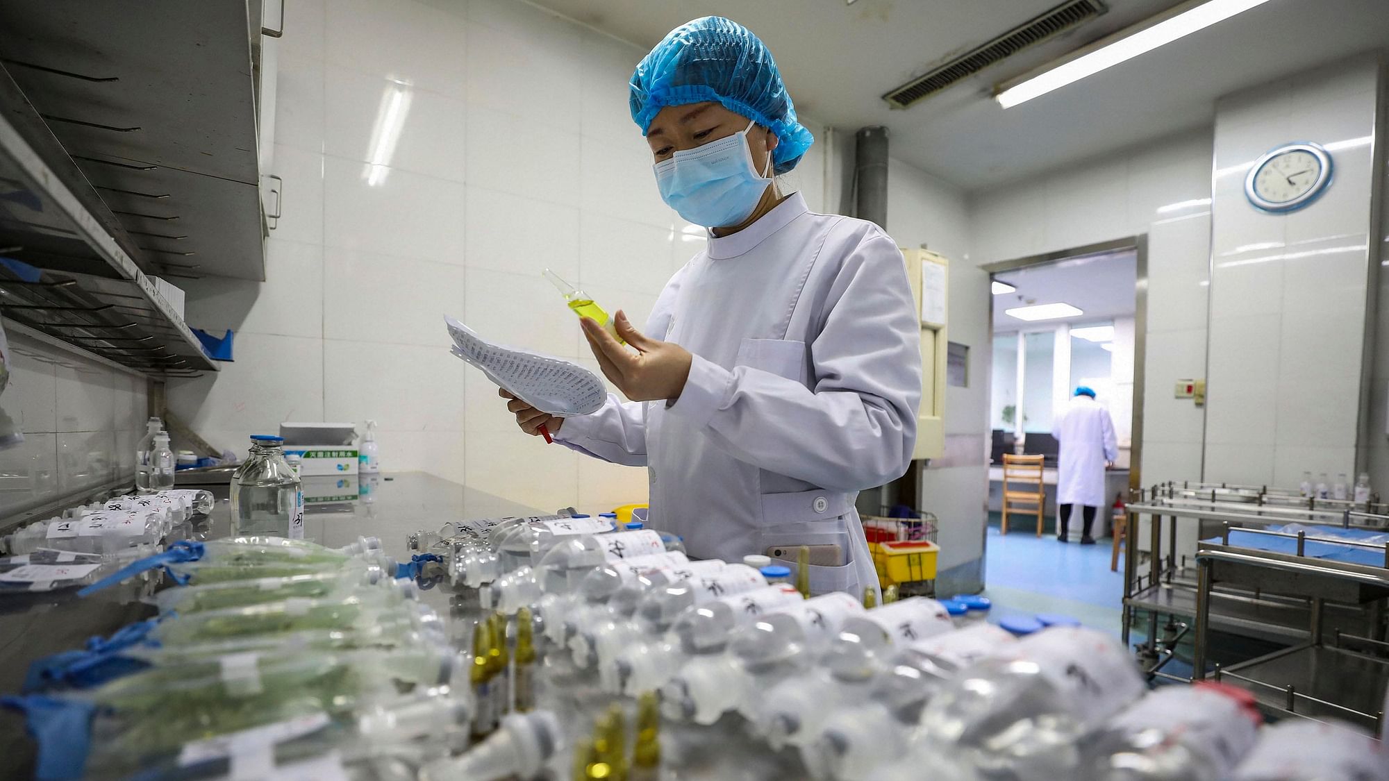 In this February 16 photo, a nurse prepares medicines for patients at Jinyintan Hospital designated for coronavirus infected patients, in Wuhan in central China's Hubei province. 