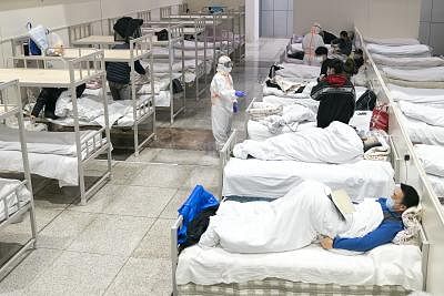 Patients infected with the novel coronavirus are seen at a makeshift hospital converted from an exhibition center in Wuhan, central China