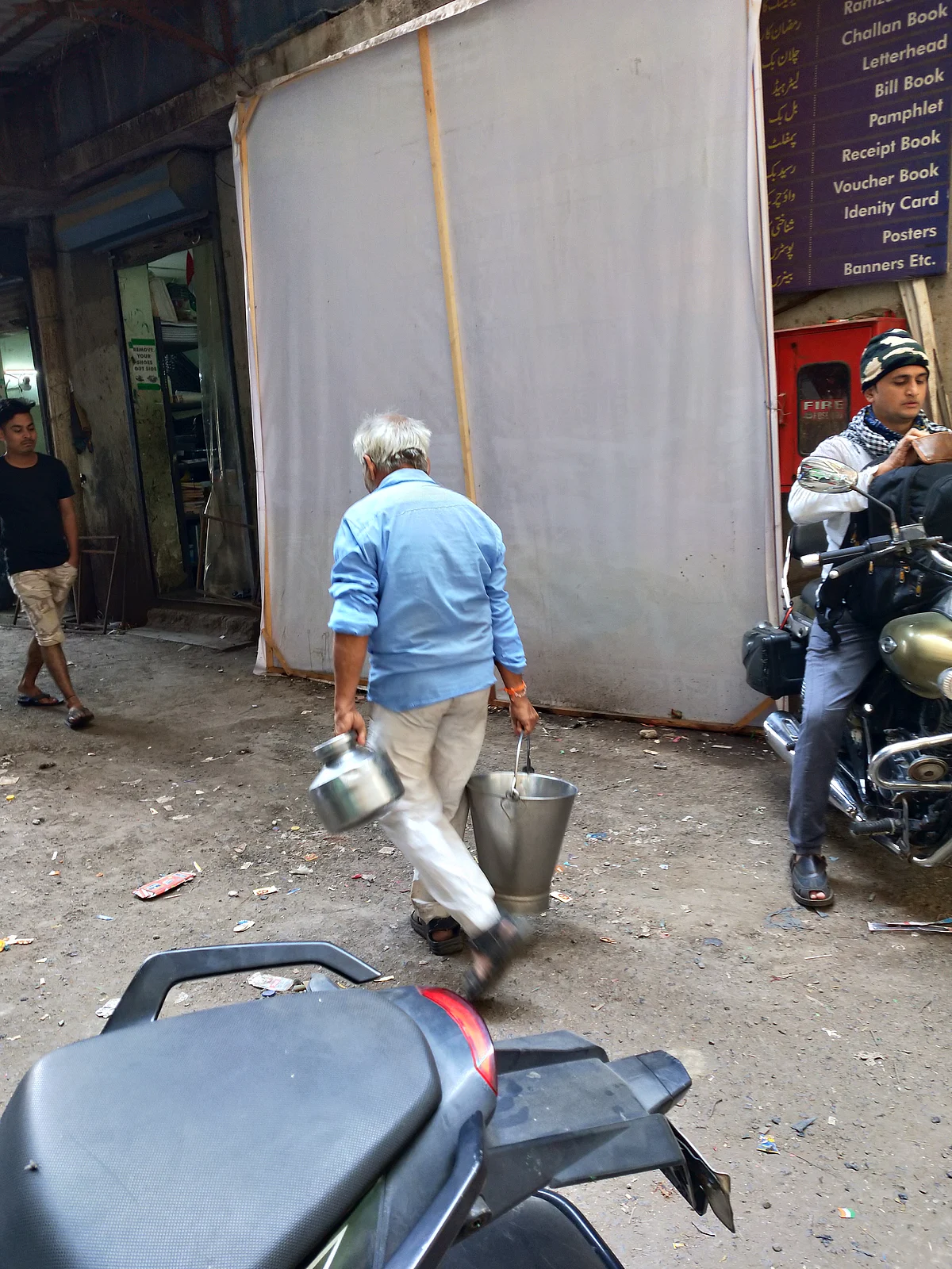 Everyone in the area can be seen carrying buckets. 