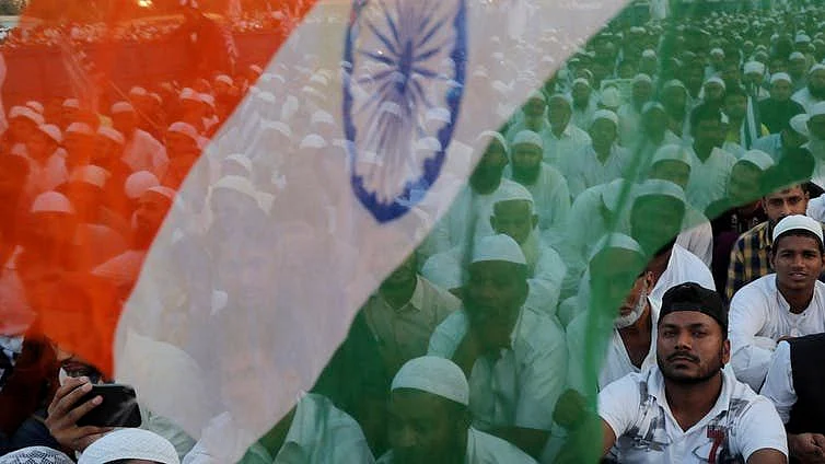 Indian Muslims participate in a protest against a new citizenship law.