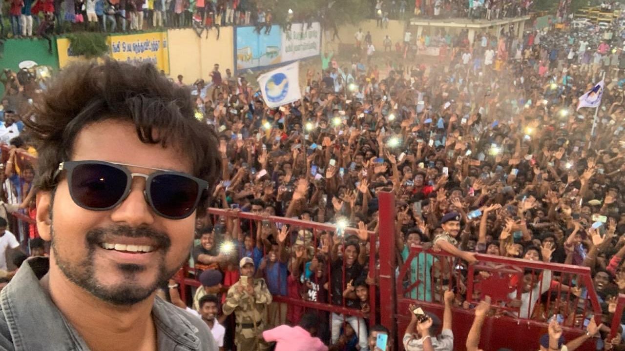 Tamil actor Vijay clicks selfie with fans on sets of his film <i>Master</i>.