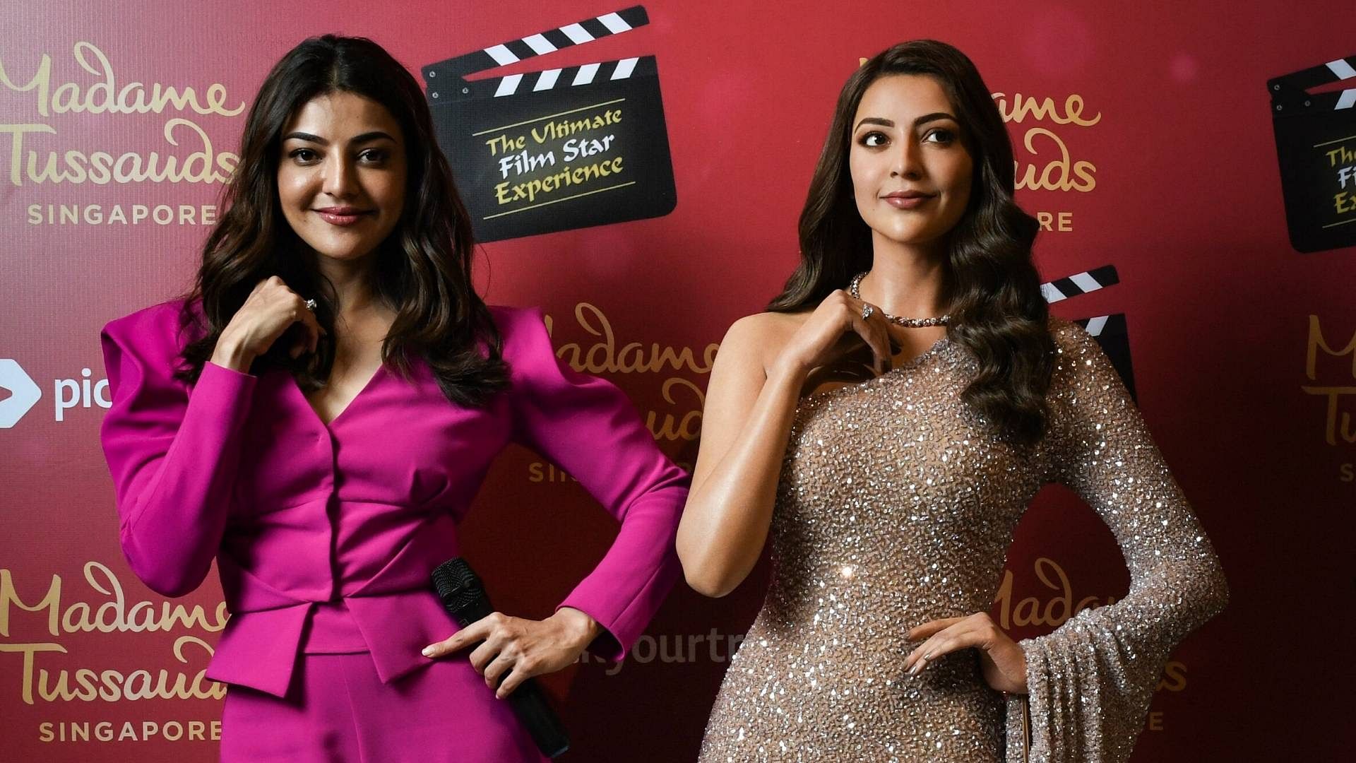 Actor Kajal Aggarwal with her wax statue at Madame Tussauds Singapore.
