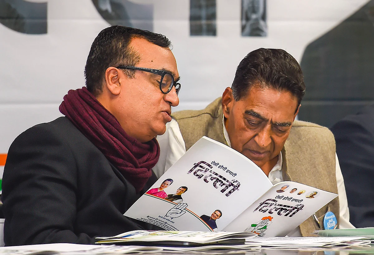 DPCC President Subhash Chopra (R) with party leader Ajay Maken at the release of the Congress manifesto for the Delhi Assembly elections, at a press conference at the DPCC office, in New Delhi, Sunday, Feb. 2, 2020.
