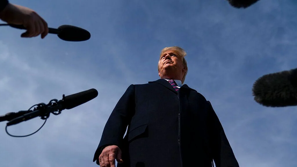 President Donald Trump talks with reporters before boarding Air Force One for a trip to Los Angeles to attend a campaign fundraiser on Tuesday, 18 February 2020, in Andrews Air Force Base.