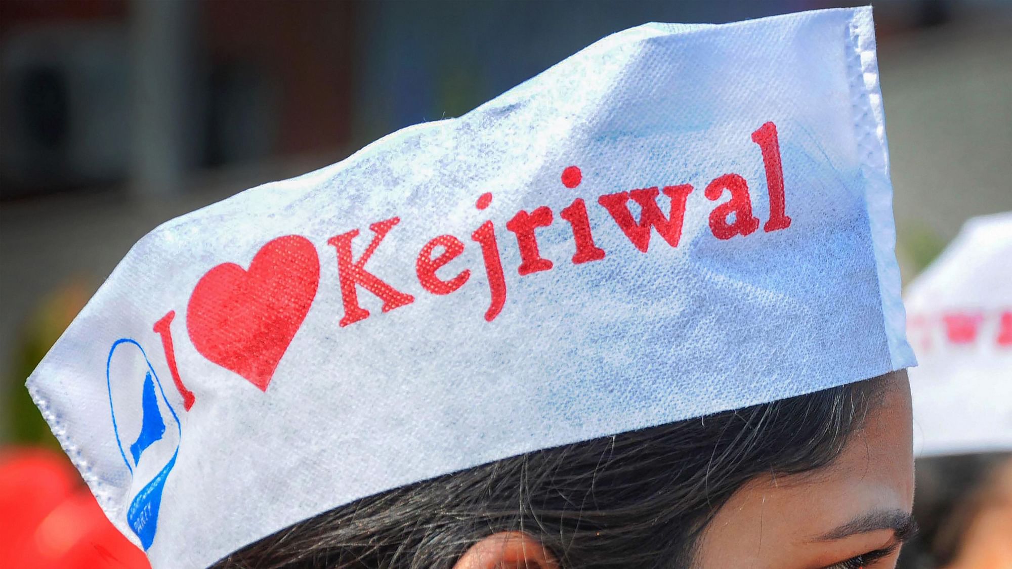 An AAP supporter dons an ‘I Love Kejriwal’ cap during result day.