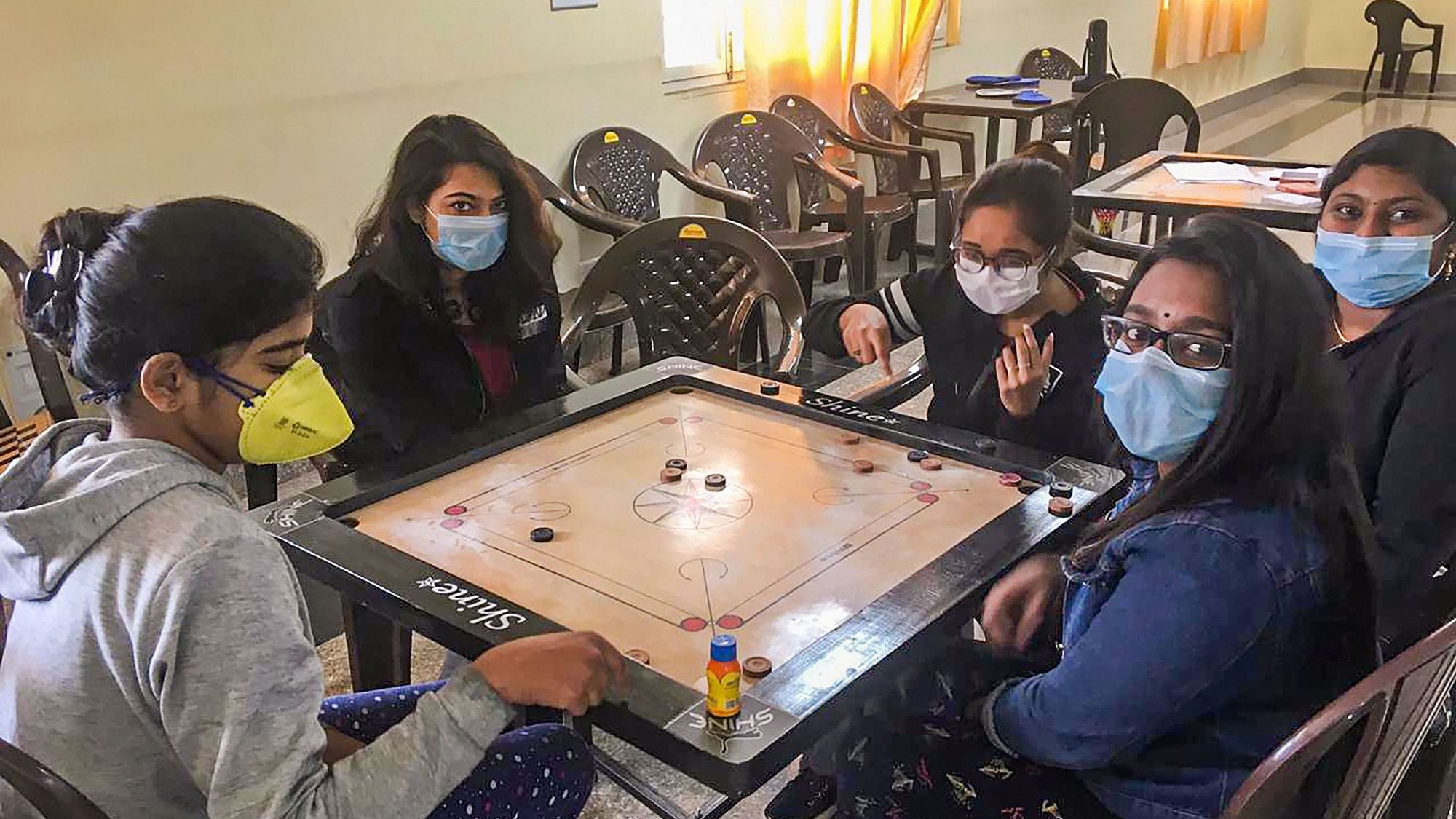 Indians evacuated from China amid the outbreak of the Coronavirus epidemic play carom at a quarantine facility set by up ITBP, at Chhawla area of New Delhi.