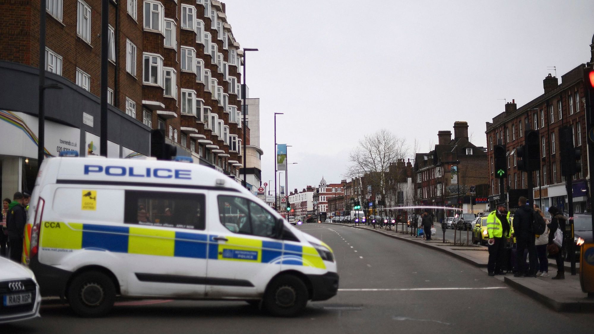 Police at the scene after an incident in Streatham, London, Sunday, 2 February. London police say officers shot a man during a terrorism-related incident that involved the stabbings of a number of people.