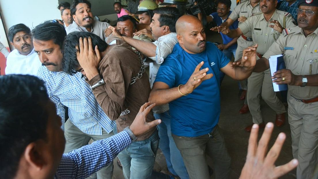 Kashmiri students being roughed by allegedly right wing groups, as they were being produced in the Hubballi court on Monday, 17 February.