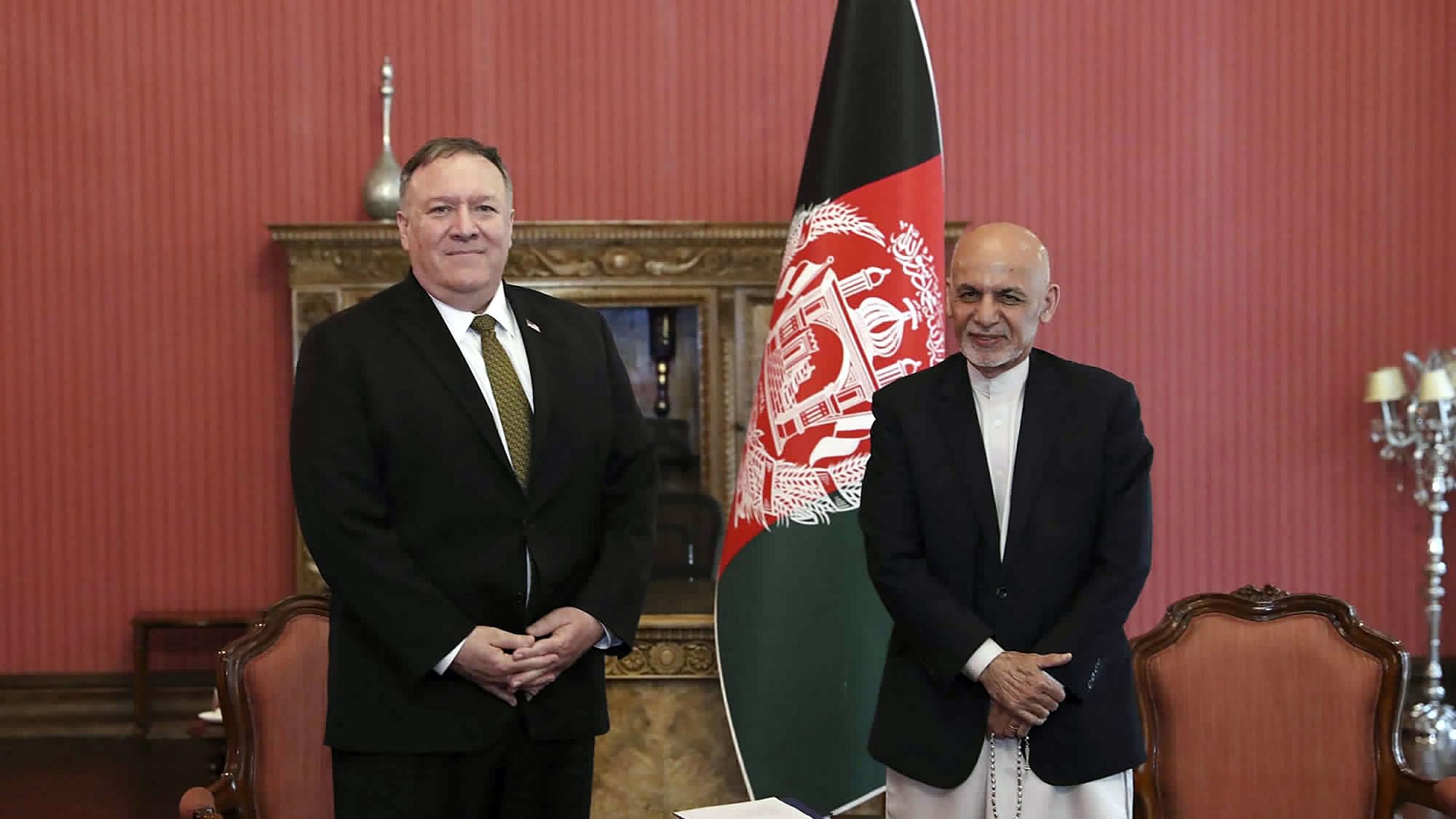 US Secretary of State Mike Pompeo, left, stands with Afghan President Ashraf Ghani, at the Presidential Palace in Kabul, Afghanistan, Monday, 23 March.