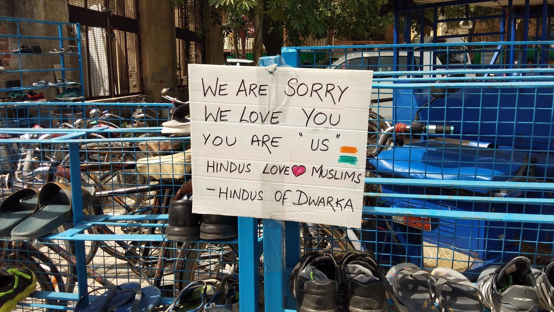 Hindus from the area put up posters of communal harmony outside the mosque in Dwarka
