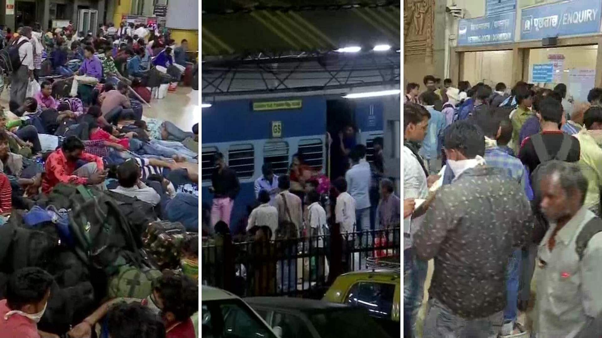 Migrant workers rush to catch trains out of Mumbai.