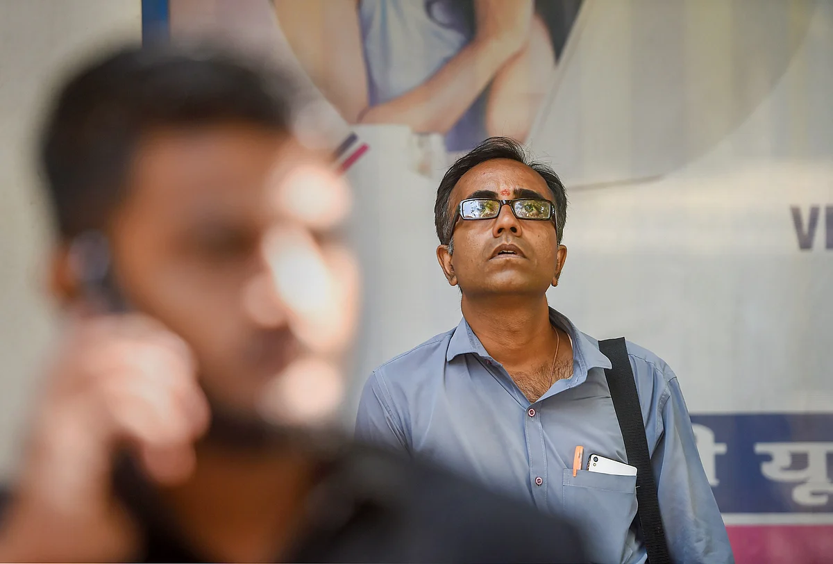 A man watches the screen outside BSE building as Sensex nosedives.