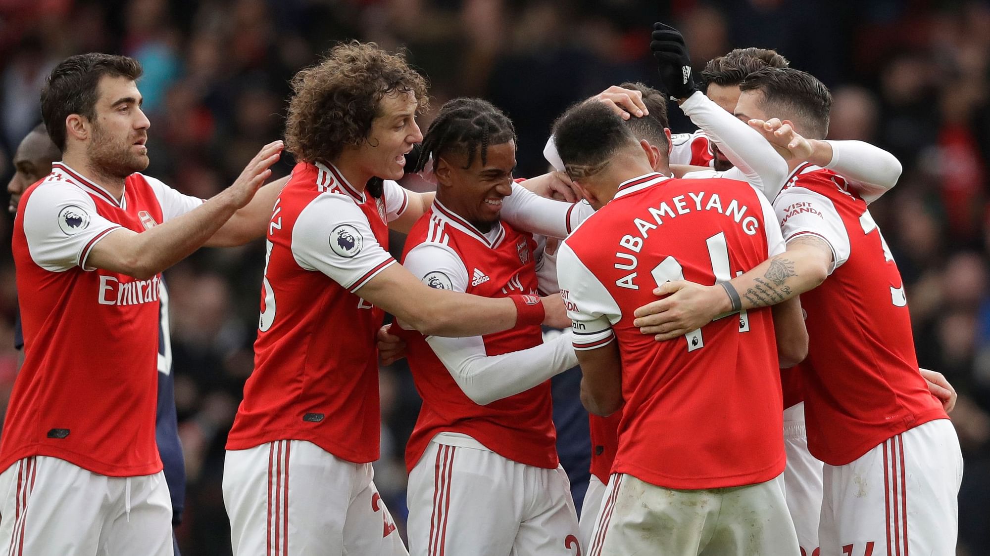 Arsenal’s players celebrate a goal during the Premier League soccer match between Arsenal and West Ham at the Emirates Stadium in London, Saturday, March 7, 2020.