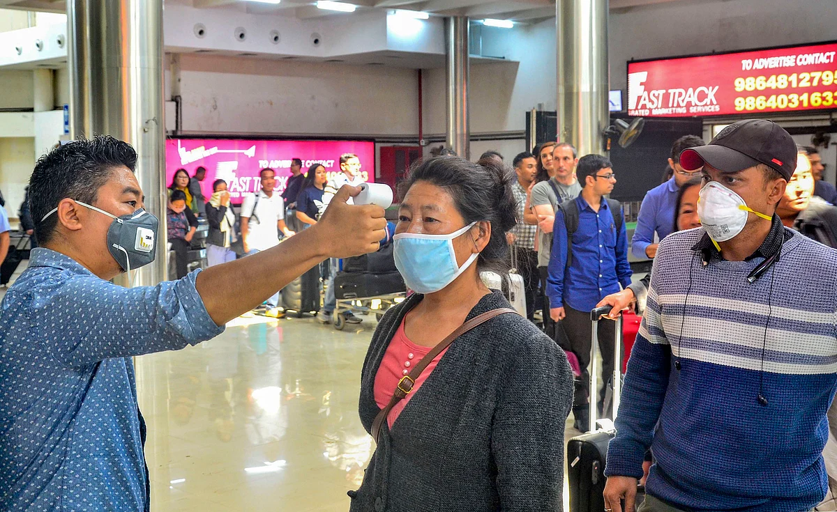 Passengers undergo a thermal screening test in the wake of novel coronavirus scare at Dimapur airport in Nagaland, Sunday. 