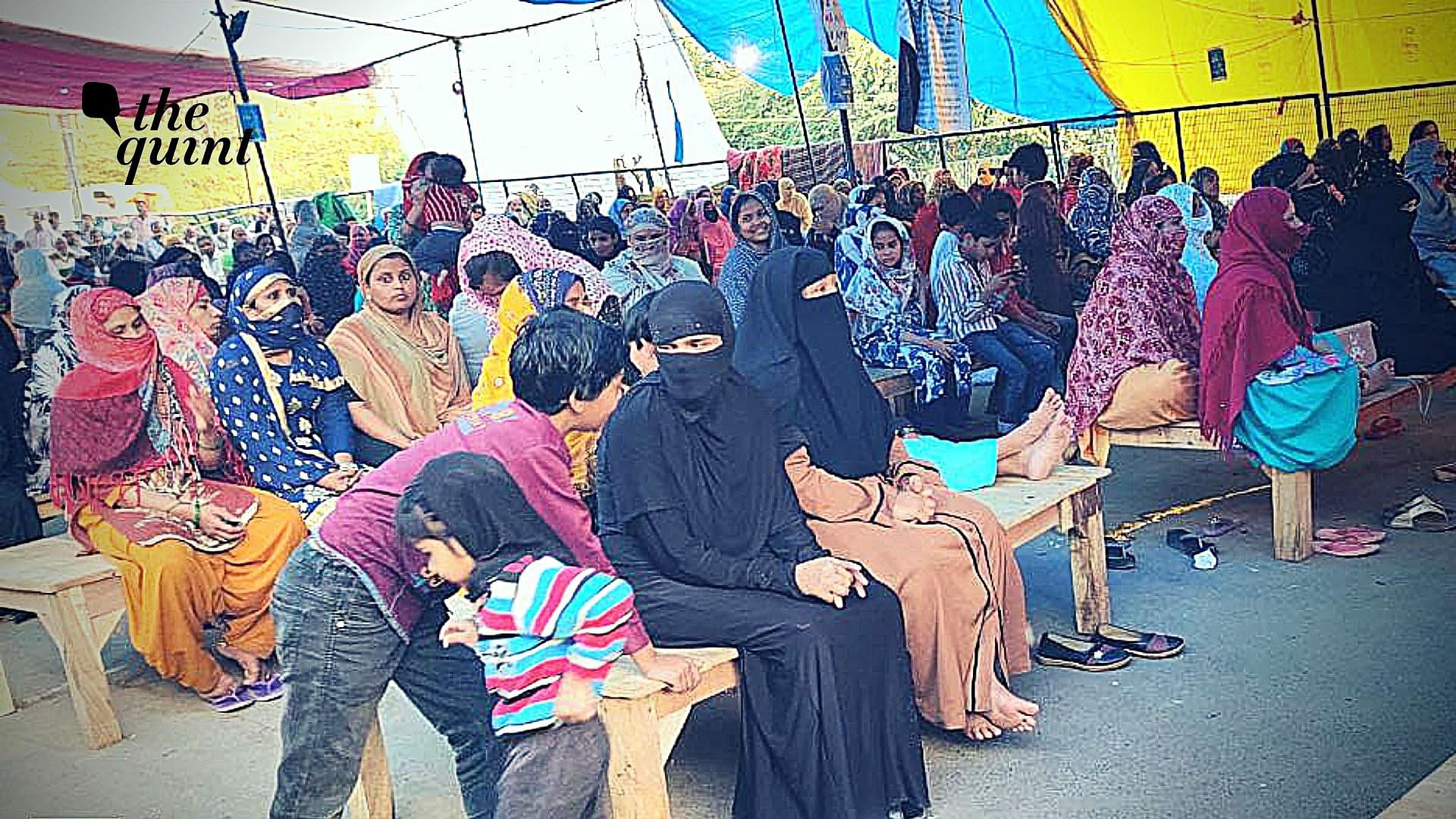 Shaheen Bagh protesters sitting on wooden beds during Coronavirus pandemic threat.